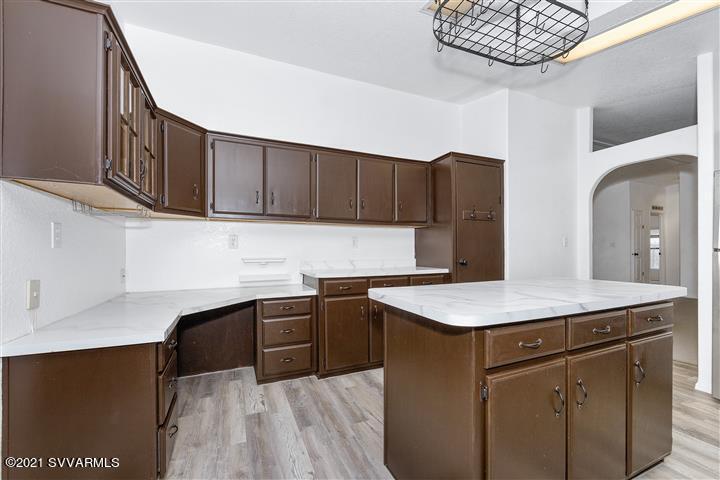 4120 East Beaver Creek Road Rimrock, AZ 86335 - Photo 12 of 31 a kitchen with stainless steel appliances granite countertop a sink stove and cabinets