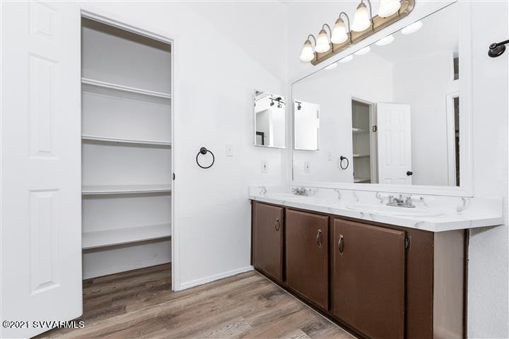 4120 East Beaver Creek Road Rimrock, AZ 86335 - Photo 18 of 31 a bathroom with a double vanity sink and a mirror