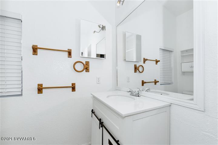 4120 East Beaver Creek Road Rimrock, AZ 86335 - Photo 22 of 31 a bathroom with a sink and a mirror