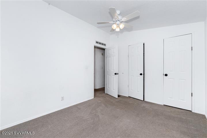 4120 East Beaver Creek Road Rimrock, AZ 86335 - Photo 25 of 31 an empty room with a ceiling fan