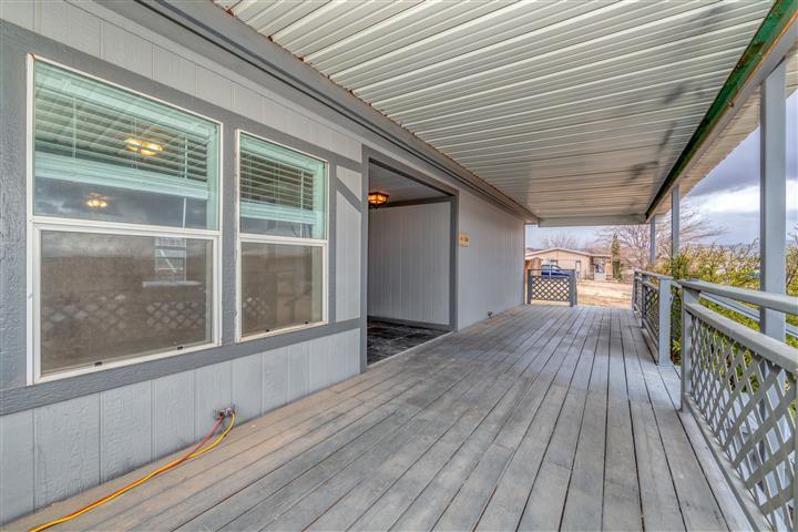 4120 East Beaver Creek Road Rimrock, AZ 86335 - Photo 3 of 31 a view of a balcony with wooden floor