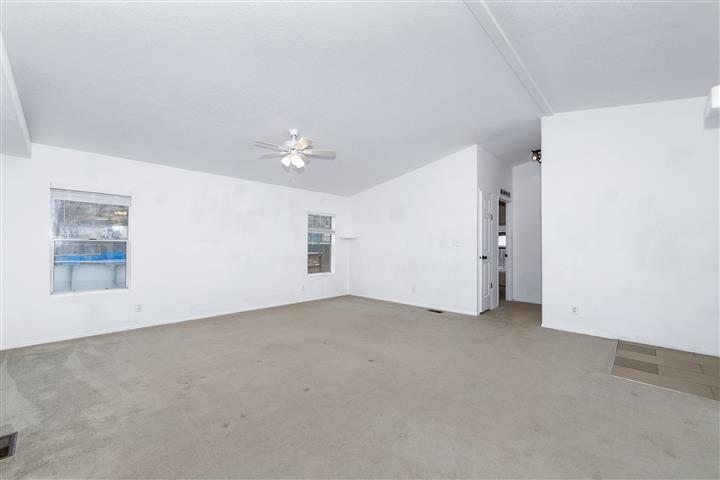 4120 East Beaver Creek Road Rimrock, AZ 86335 - Photo 7 of 31 an empty room with windows and fan