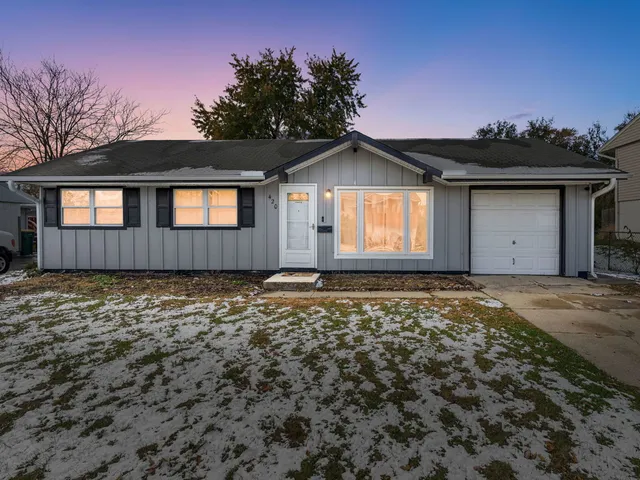 front view of a house with a yard