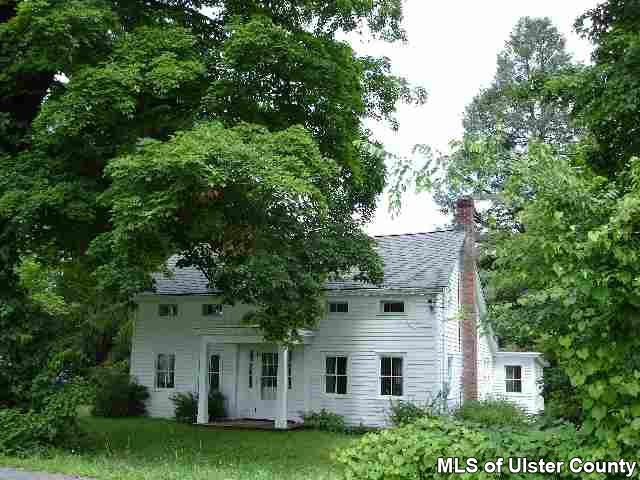 54 Pine Bush Road Stone Ridge, NY 12484 - Photo 1 of 5 a view of a yard in front of a house with a large tree