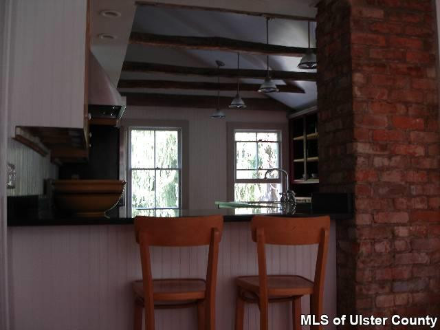 54 Pine Bush Road Stone Ridge, NY 12484 - Photo 3 of 5 a view of a dining room with furniture and a window