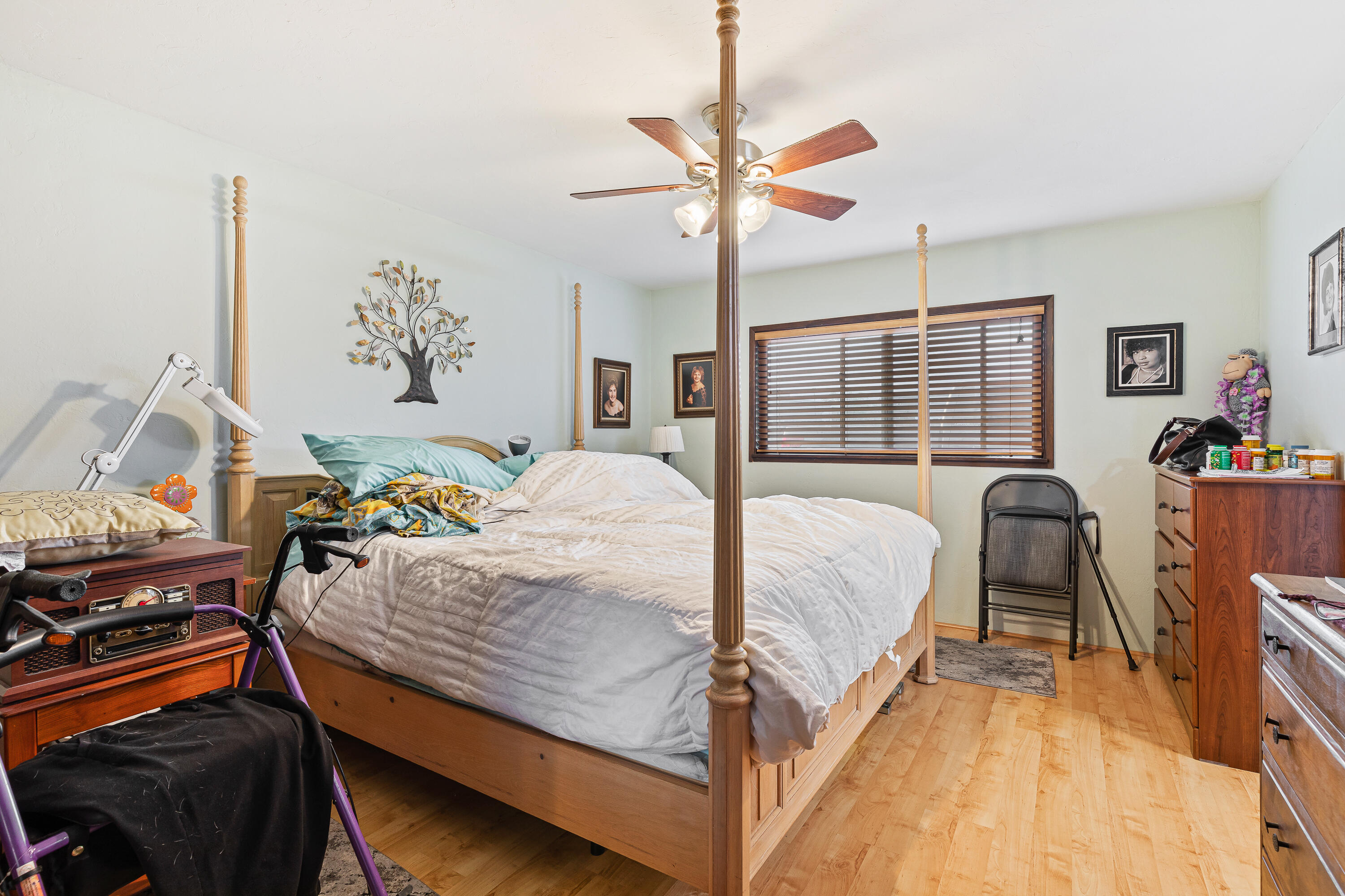 2627 Merriman Road Medford, OR 97501 - Photo 13 of 25 a bedroom with a bed and a chandelier