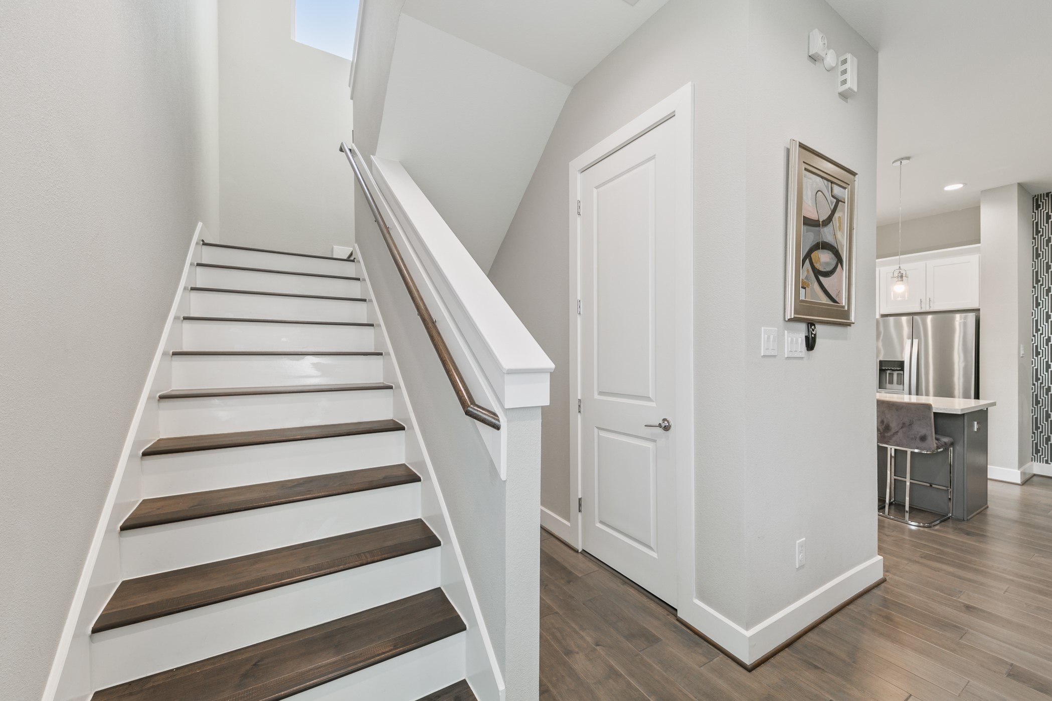 4032 Buck Street, Unit A Houston, TX 77020 - Photo 22 of 39 a view of entryway with wooden floor and stair