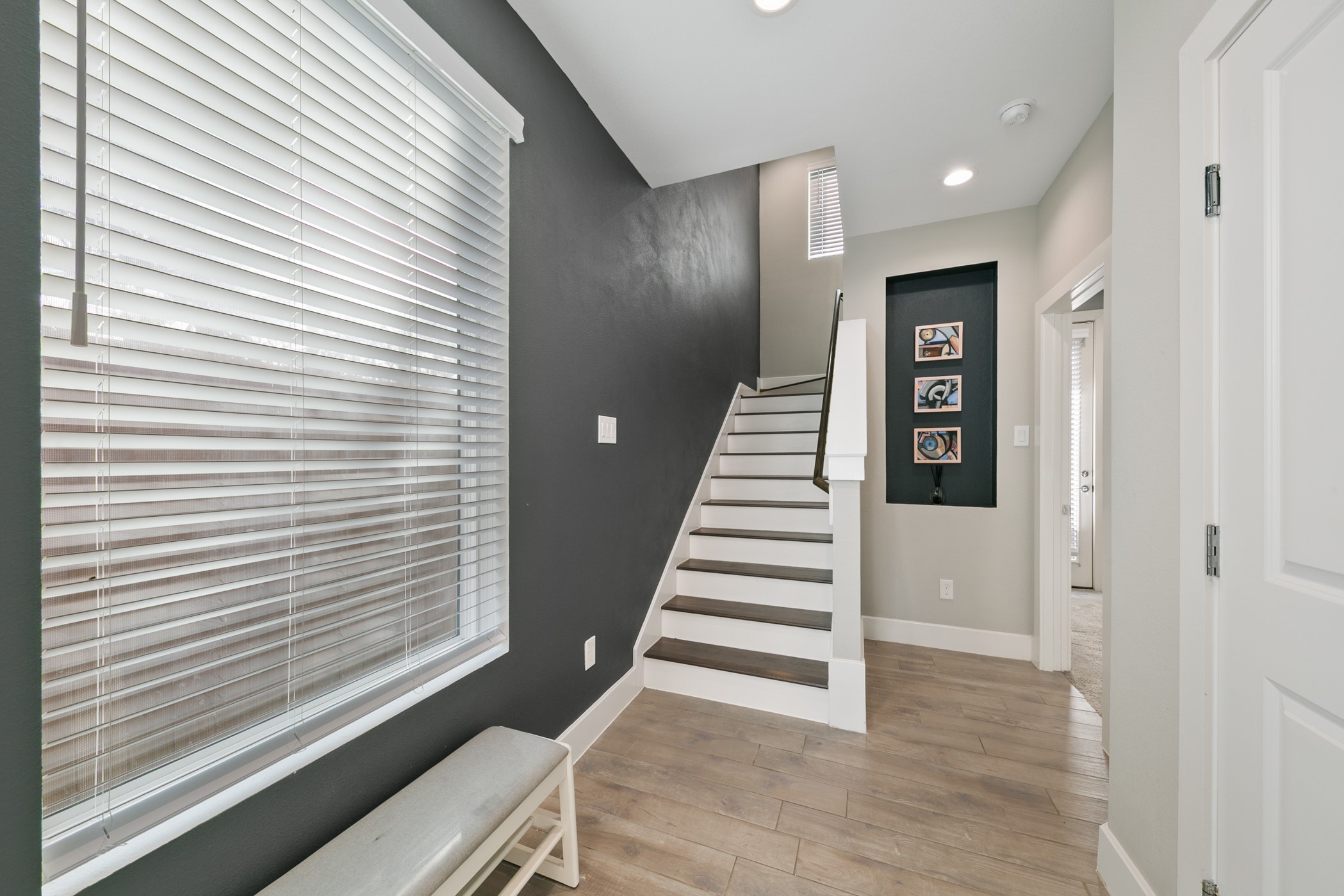 4032 Buck Street, Unit A Houston, TX 77020 - Photo 3 of 39 a view of a hallway with stairs and a window