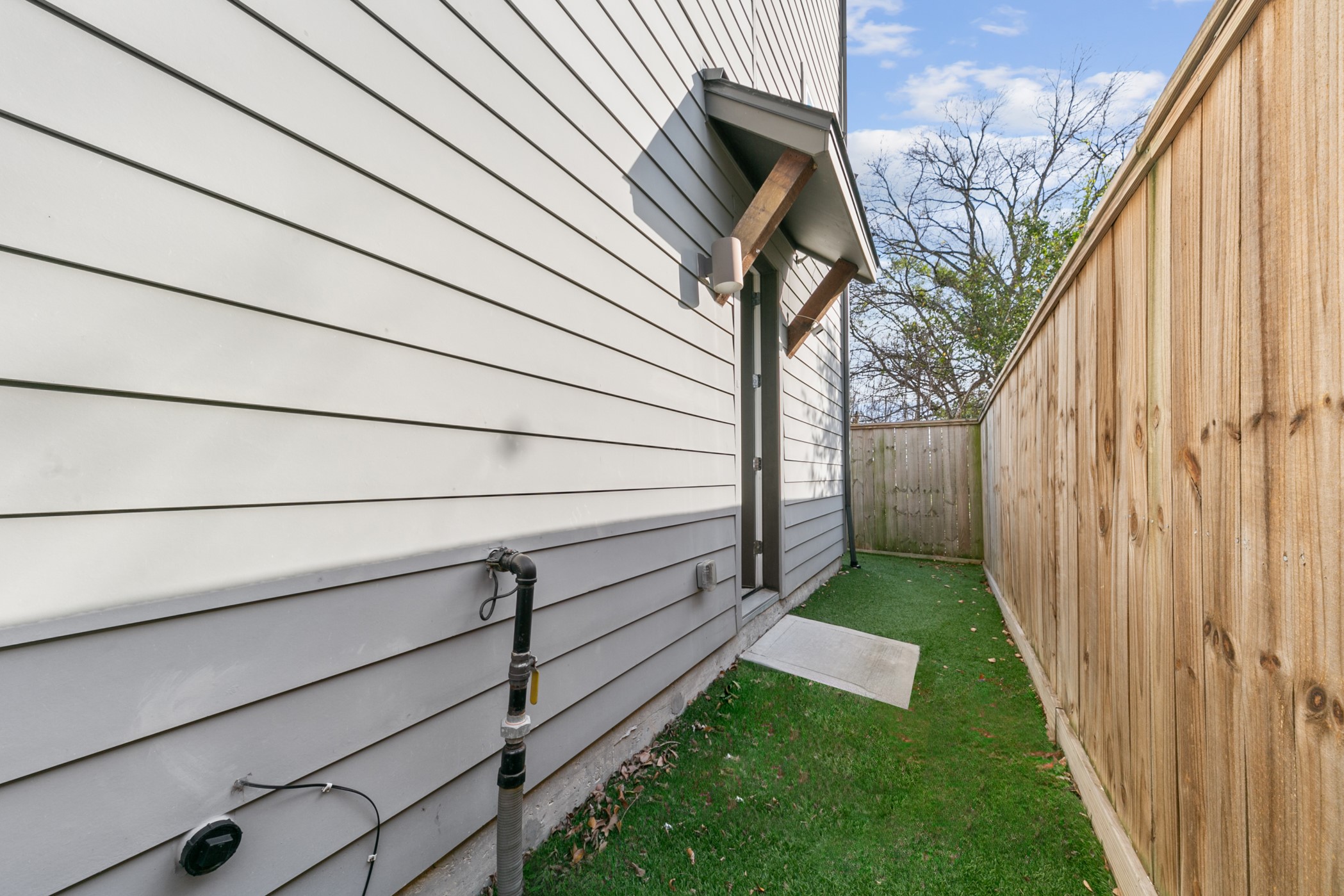 4032 Buck Street, Unit A Houston, TX 77020 - Photo 8 of 39 a view of a backyard with wooden fence