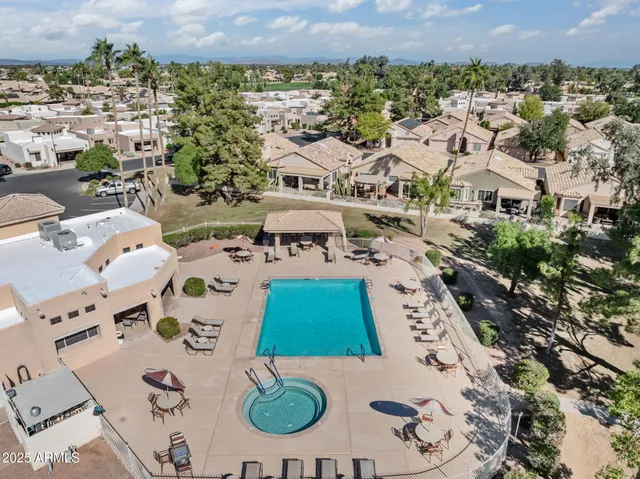 an aerial view of a house with a swimming pool