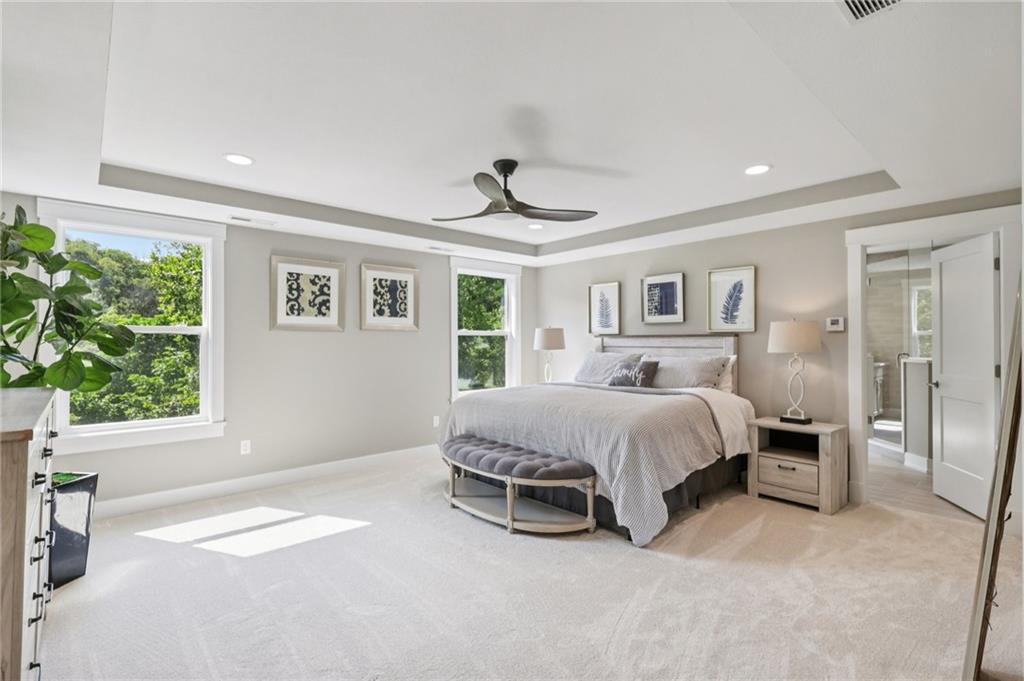 102 Bartlett Lane Wexford, PA 15090 - Photo 23 of 40 a spacious bedroom with a bed and a window