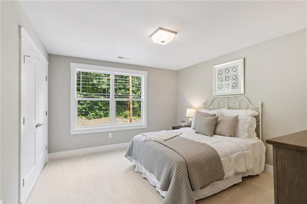 102 Bartlett Lane Wexford, PA 15090 - Photo 29 of 40 a bedroom with a large bed and a window