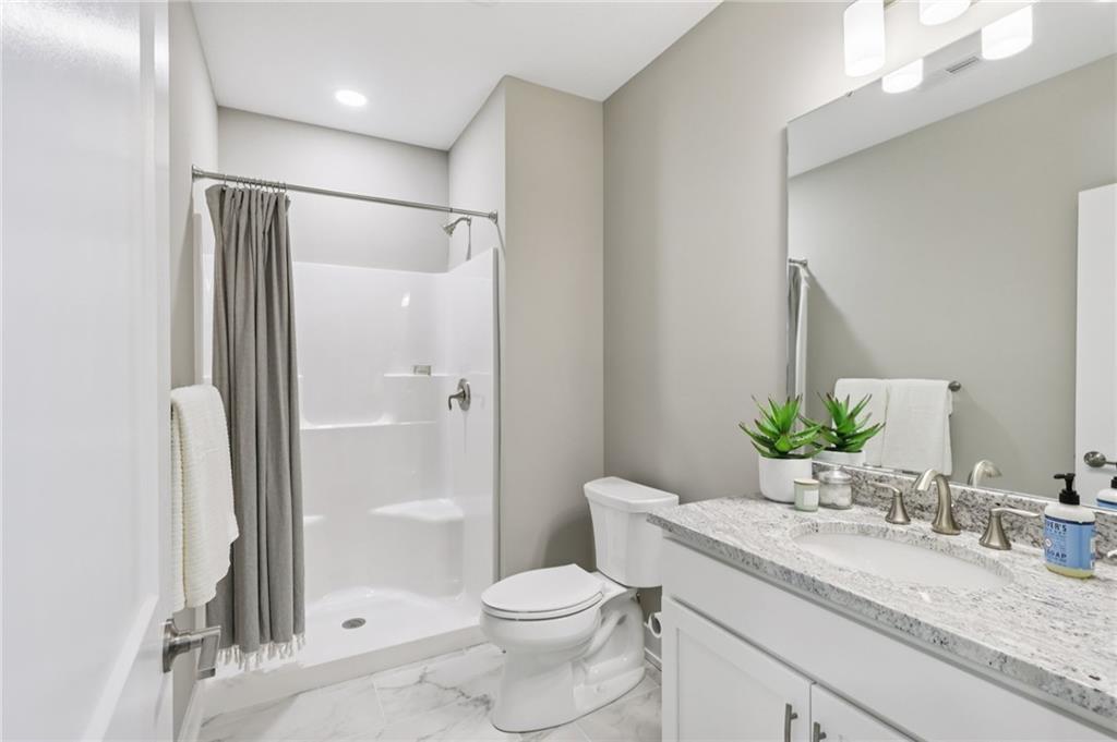 102 Bartlett Lane Wexford, PA 15090 - Photo 36 of 40 a bathroom with a granite countertop sink toilet and shower