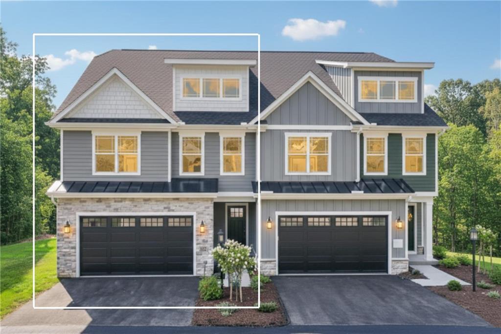 102 Bartlett Lane Wexford, PA 15090 - Photo 4 of 40 a front view of a house with plants and garage