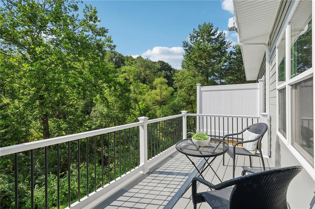 102 Bartlett Lane Wexford, PA 15090 - Photo 10 of 40 a view of a wooden chairs and table in the balcony