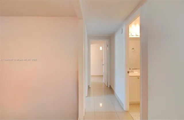 a bedroom with a bed and a lamp