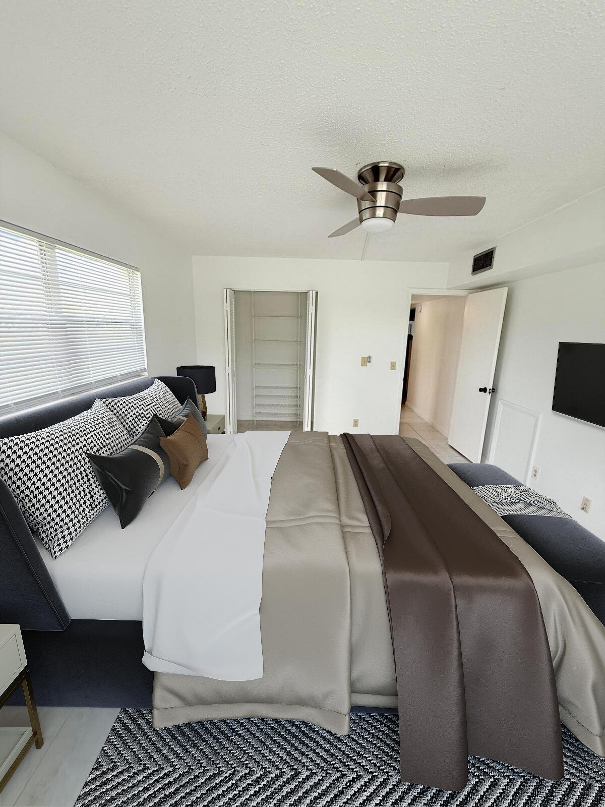 1036 Hythe B, Unit B Boca Raton, FL 33434 - Photo 12 of 53 a bedroom with bed and window