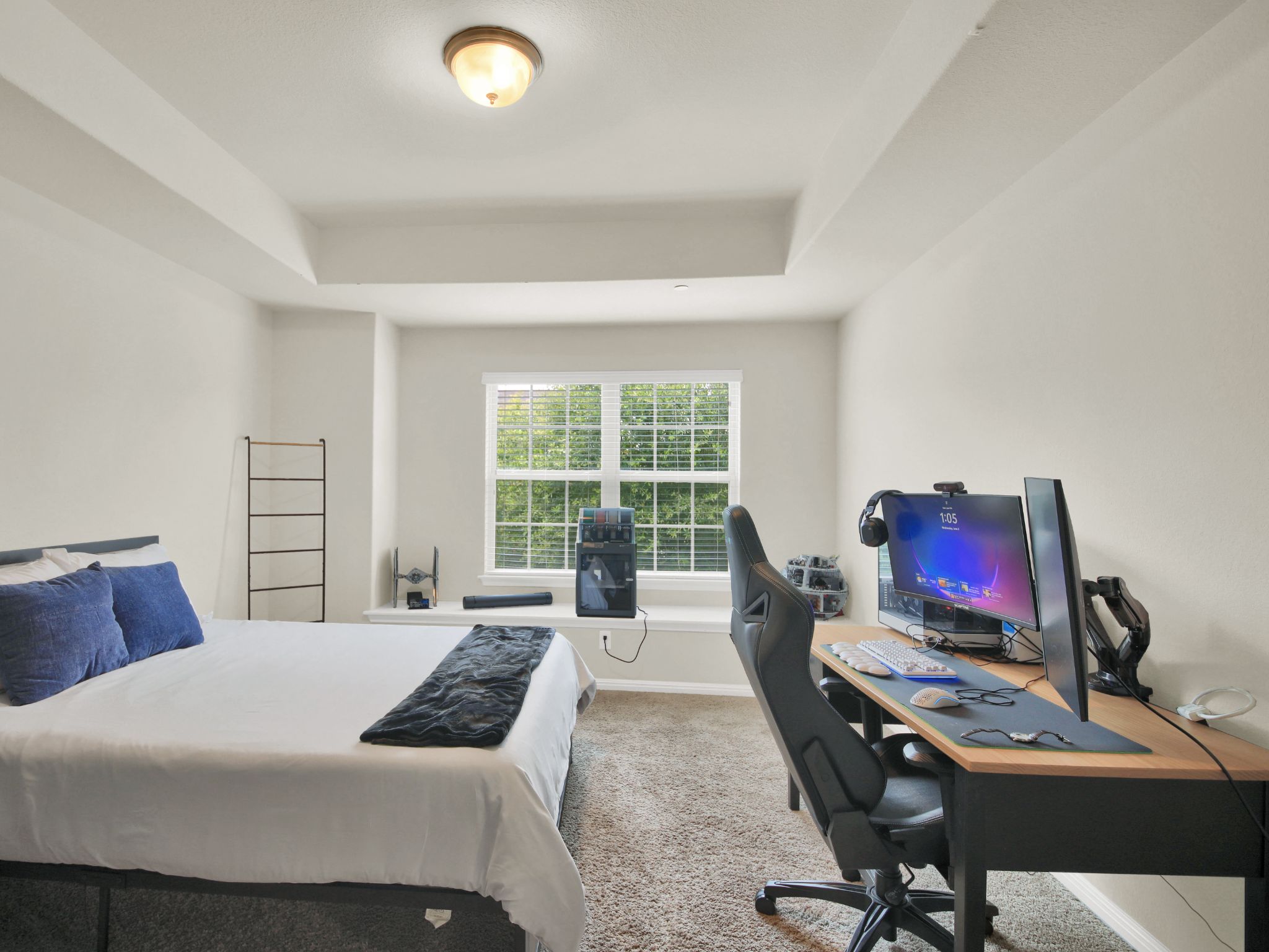 1600 Airedale Road, Unit 2601 Austin, TX 78748 - Photo 23 of 26 A well-lit bedroom with soft carpeting and a window overlooking lush greenery.