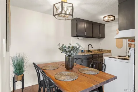a kitchen with a table and chairs in it