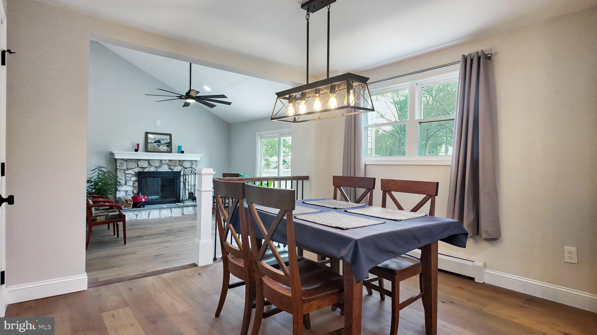 94 Sioux Road Doylestown, PA 18901 - Photo 12 of 33 a view of a dining room with furniture window and wooden floor