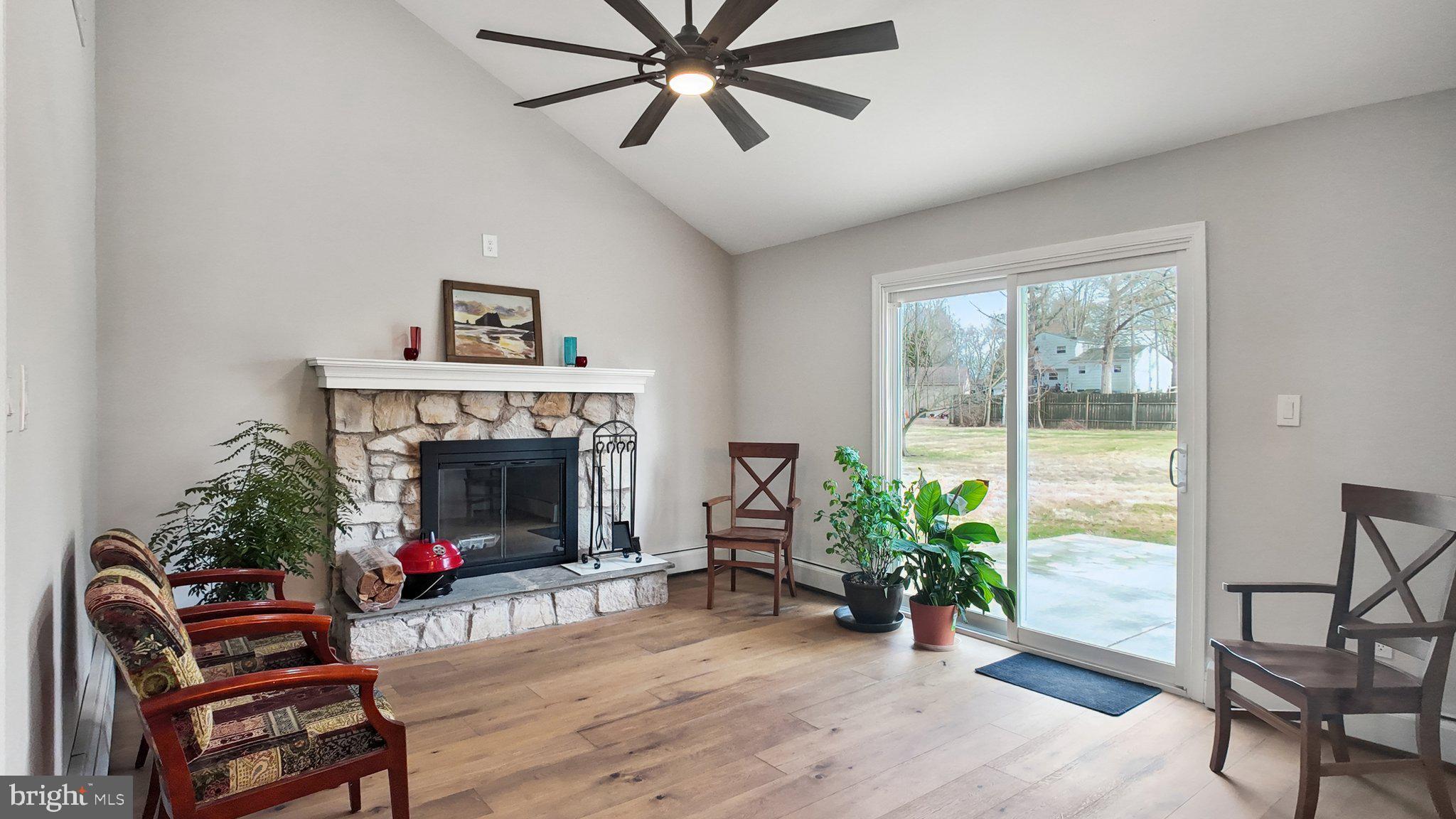94 Sioux Road Doylestown, PA 18901 - Photo 13 of 33 a living room with furniture and a fireplace