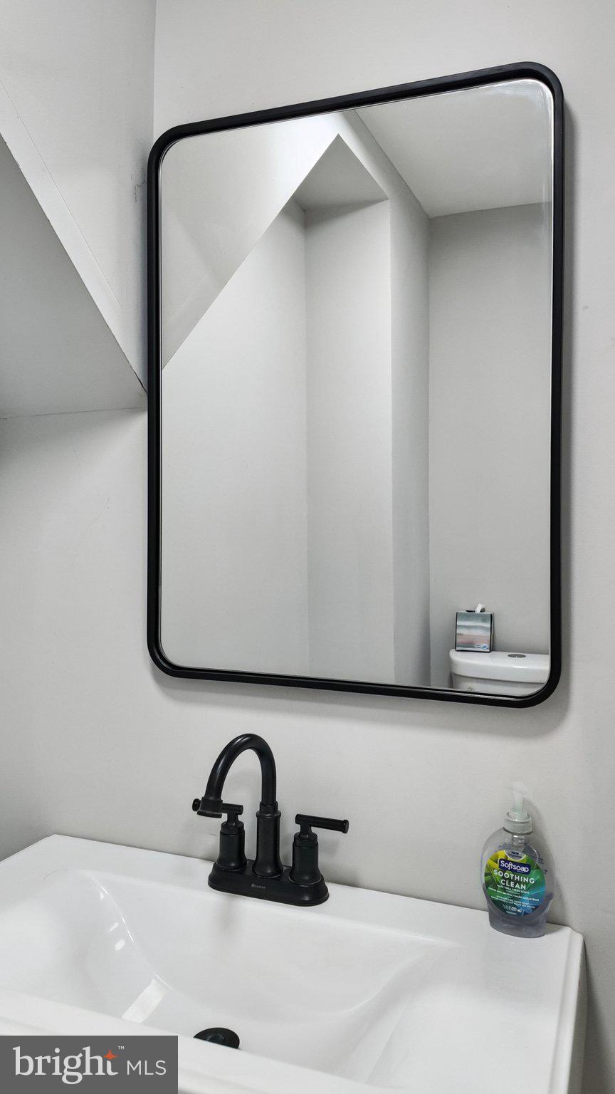 94 Sioux Road Doylestown, PA 18901 - Photo 16 of 33 a bathroom with a sink and a mirror