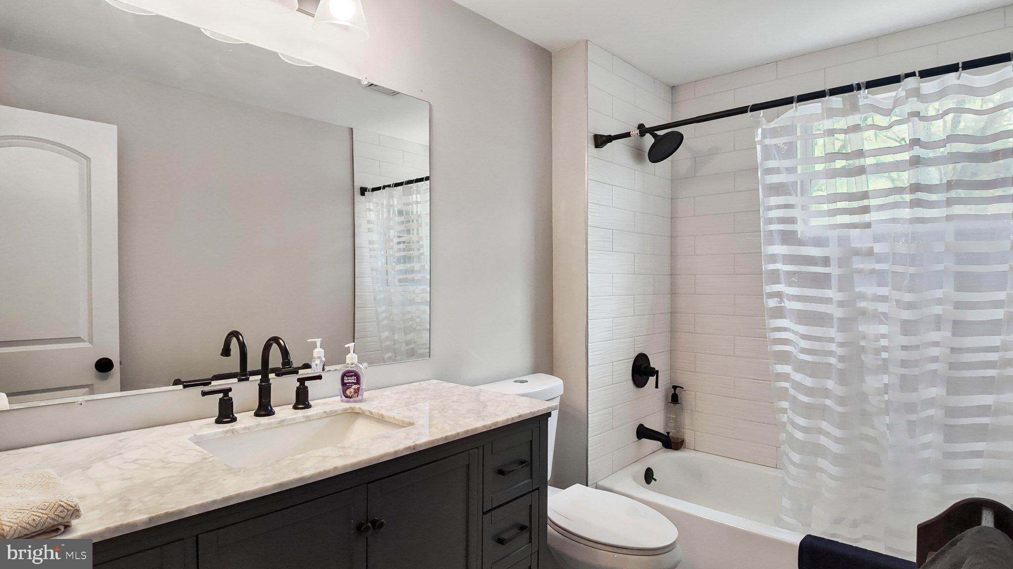 94 Sioux Road Doylestown, PA 18901 - Photo 19 of 33 a bathroom with a granite countertop sink toilet and shower