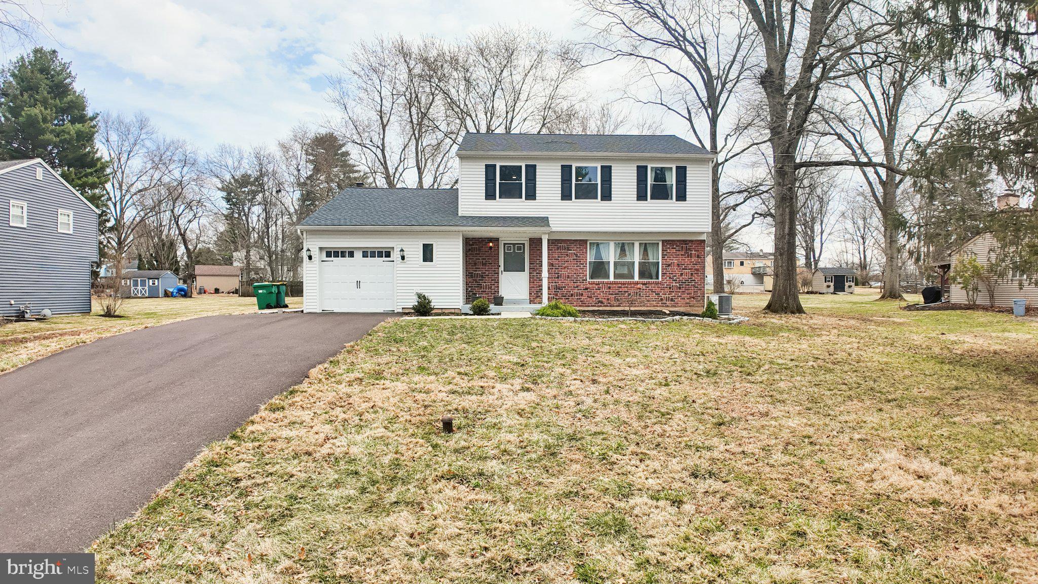 94 Sioux Road Doylestown, PA 18901 - Photo 2 of 33 front view of a house with a yard