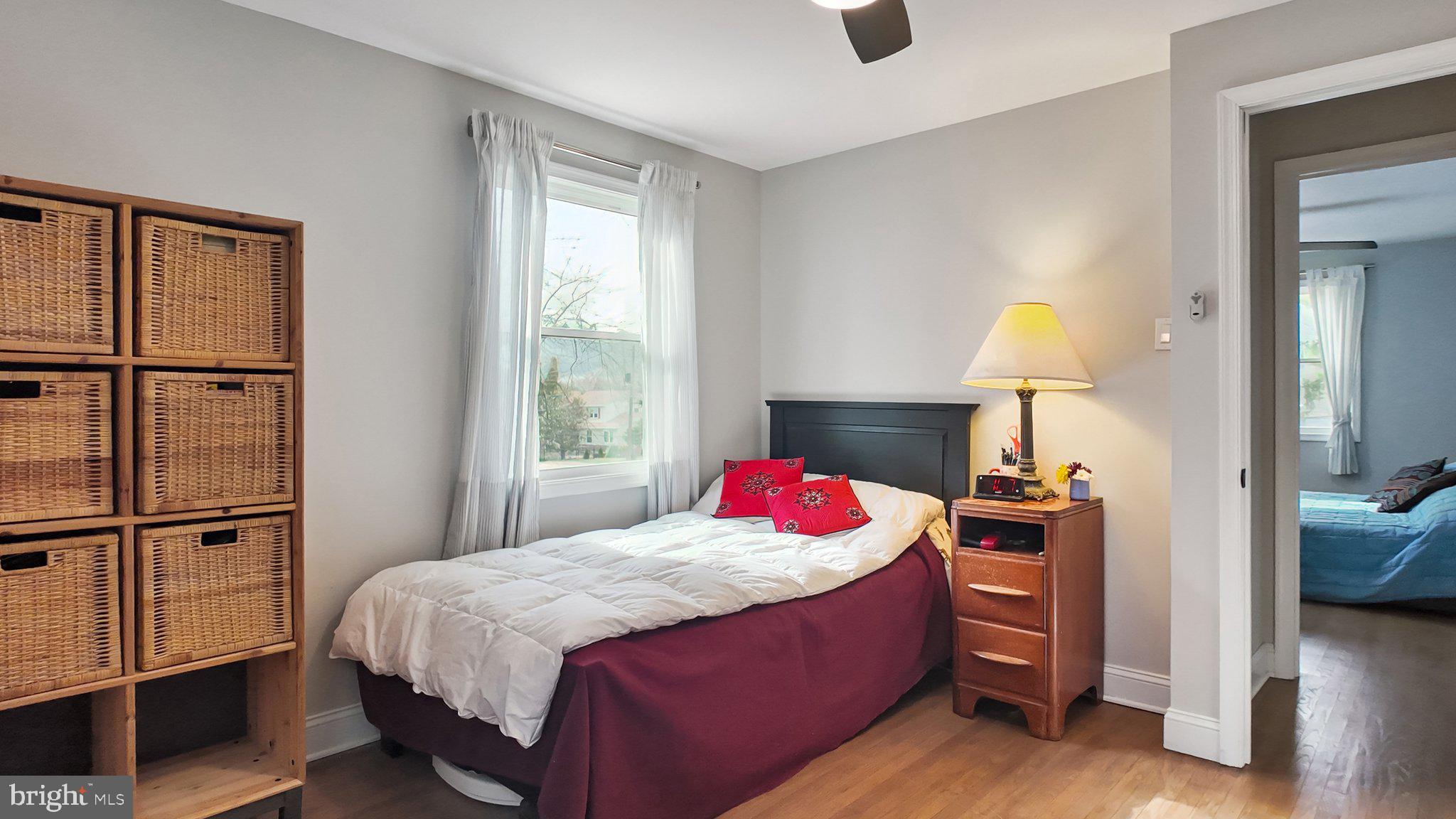 94 Sioux Road Doylestown, PA 18901 - Photo 25 of 33 a bedroom with a bed and a lamp on table