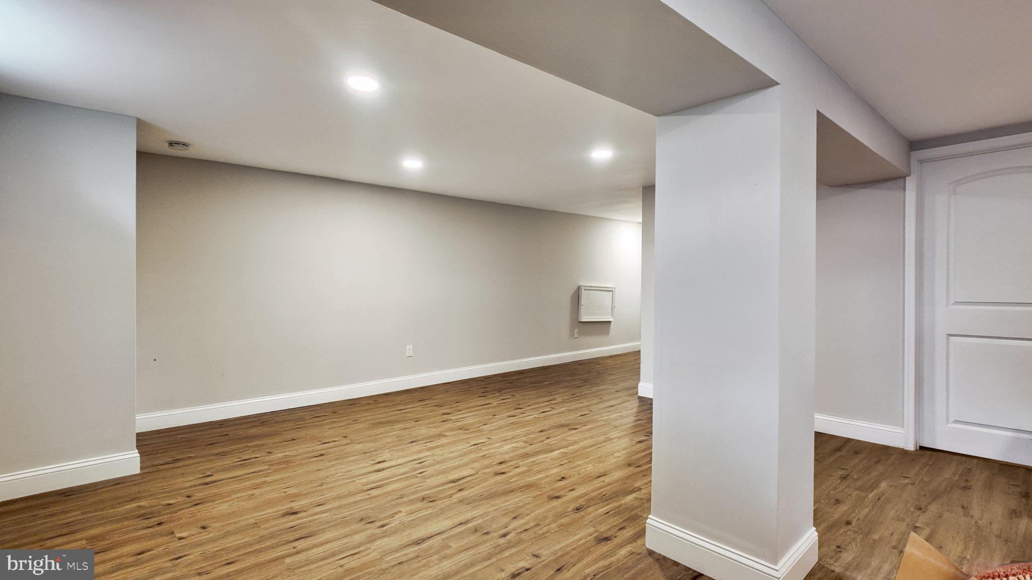 94 Sioux Road Doylestown, PA 18901 - Photo 26 of 33 an empty room with wooden floor and windows