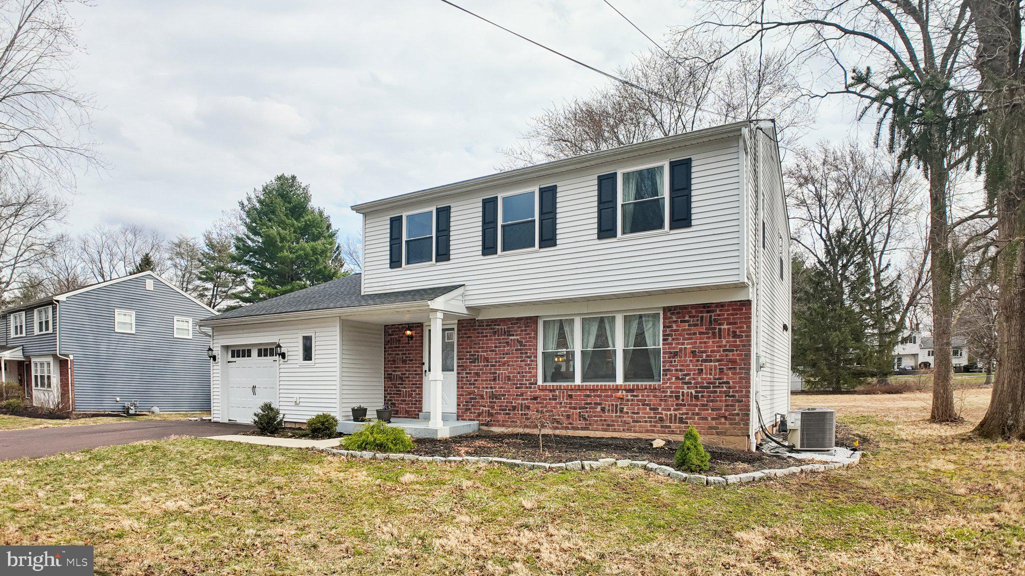 94 Sioux Road Doylestown, PA 18901 - Photo 28 of 33 a view of a yard in front of a house with large tree