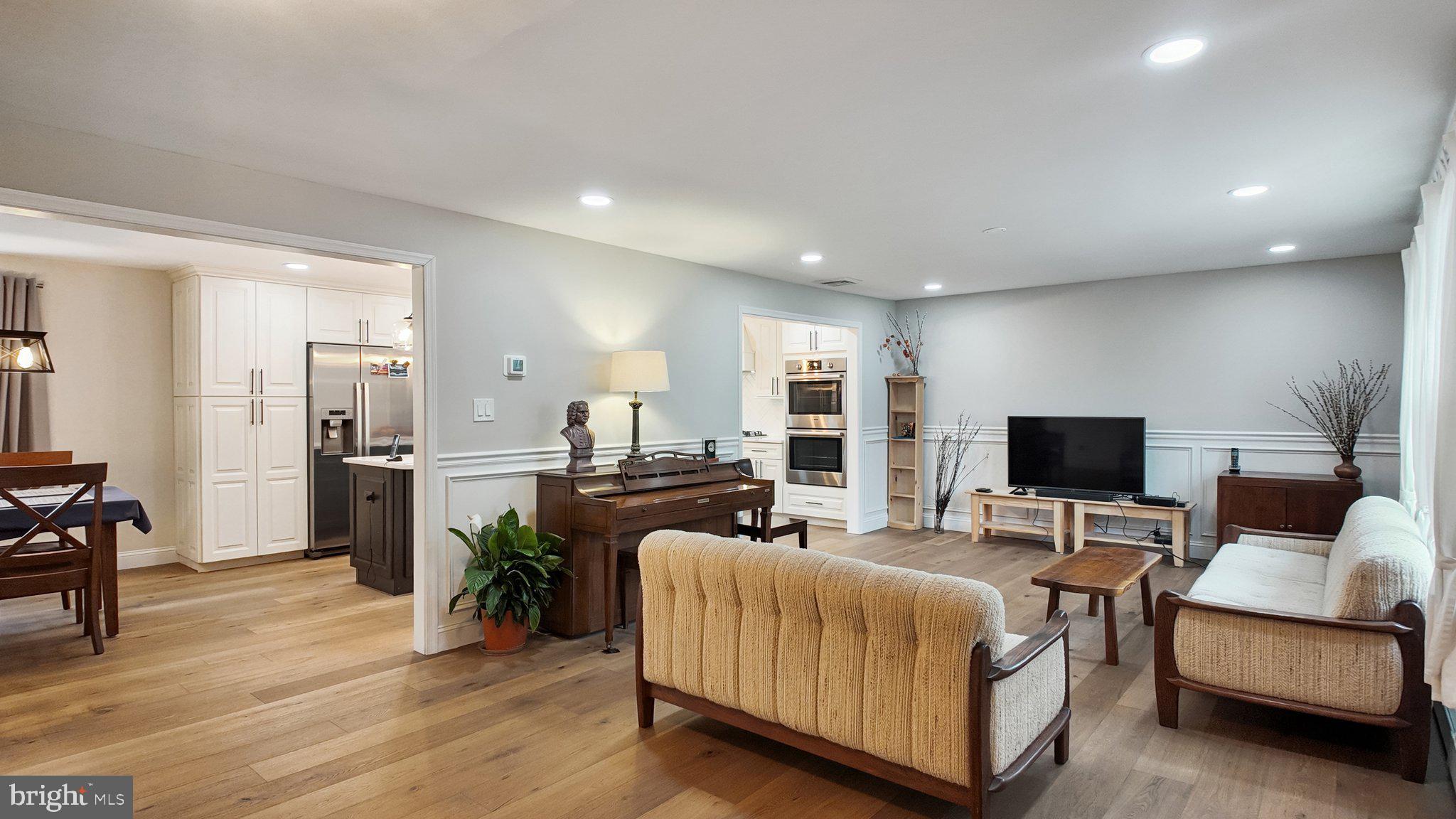 94 Sioux Road Doylestown, PA 18901 - Photo 3 of 33 a living room with furniture and a flat screen tv