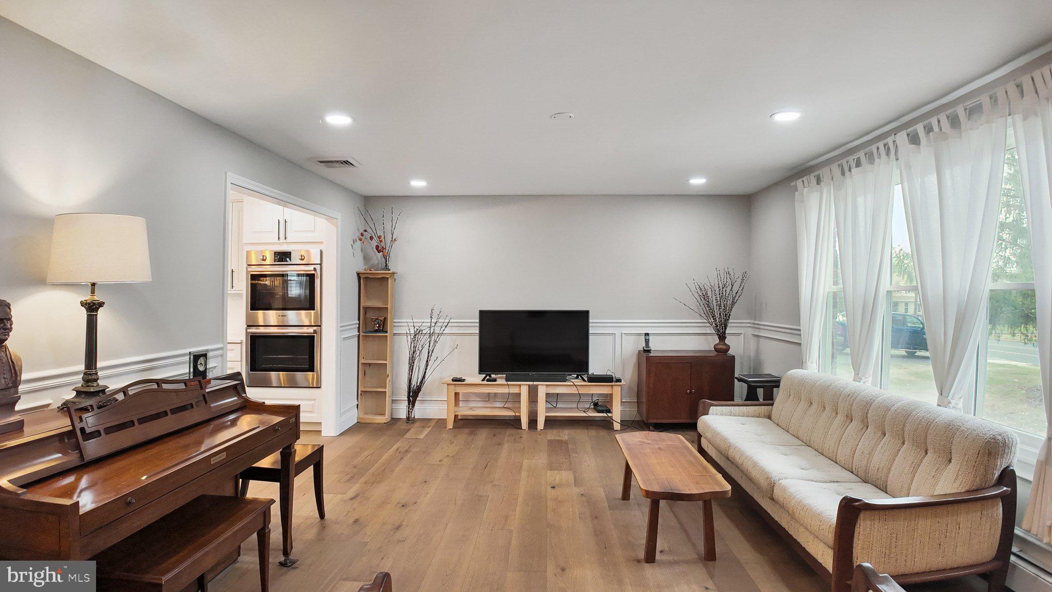 94 Sioux Road Doylestown, PA 18901 - Photo 4 of 33 a living room with furniture and a flat screen tv