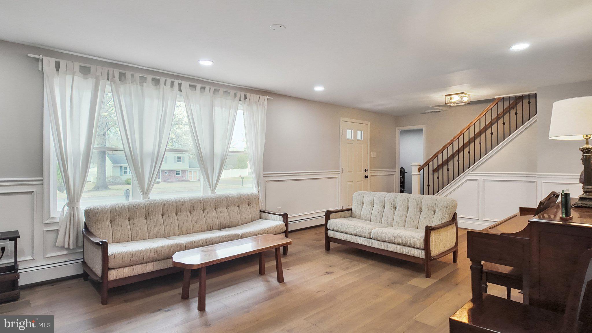 94 Sioux Road Doylestown, PA 18901 - Photo 5 of 33 a living room with furniture and a wooden floor