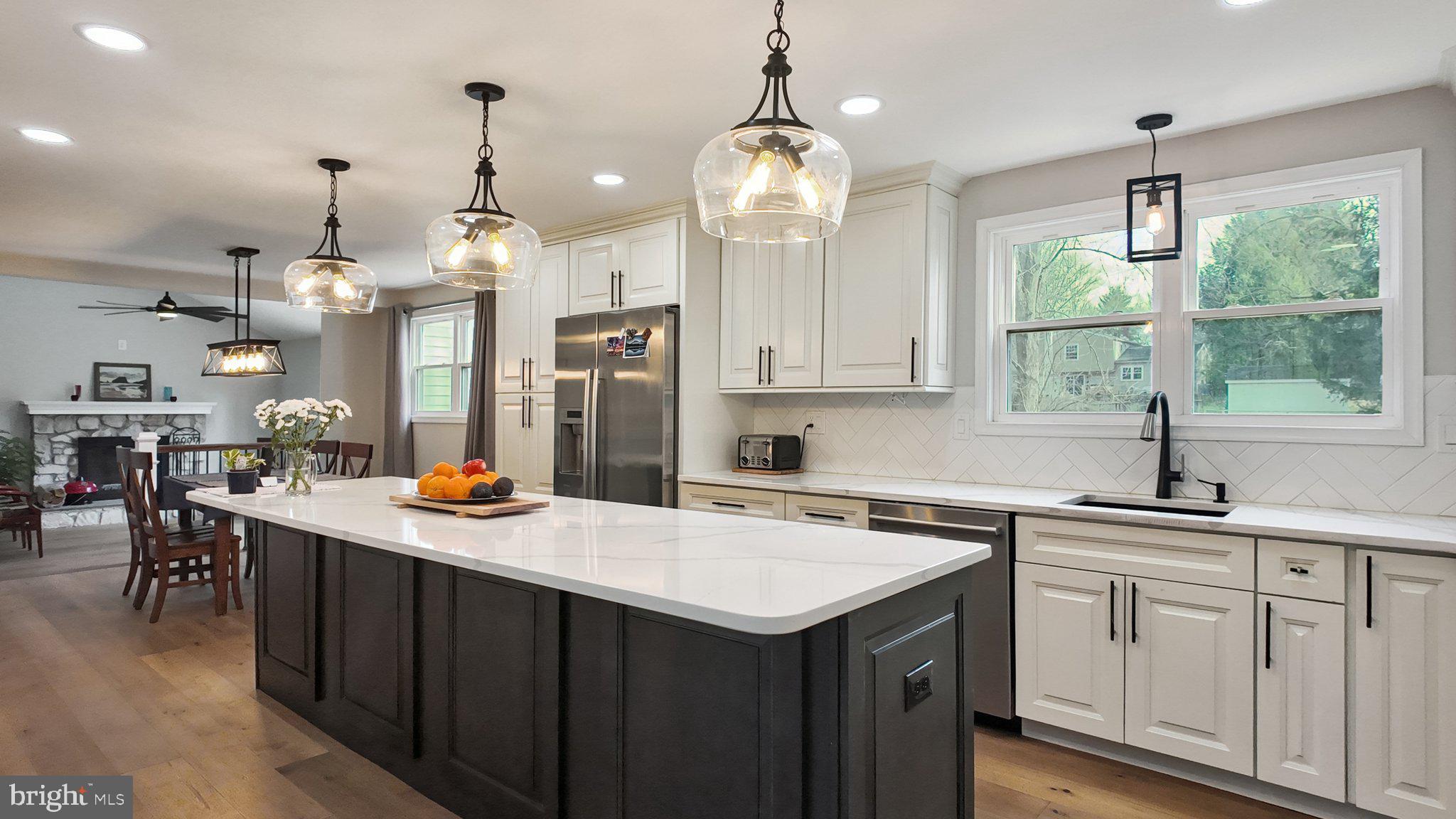 94 Sioux Road Doylestown, PA 18901 - Photo 8 of 33 a kitchen that has a lot of white cabinets and stainless steel appliances