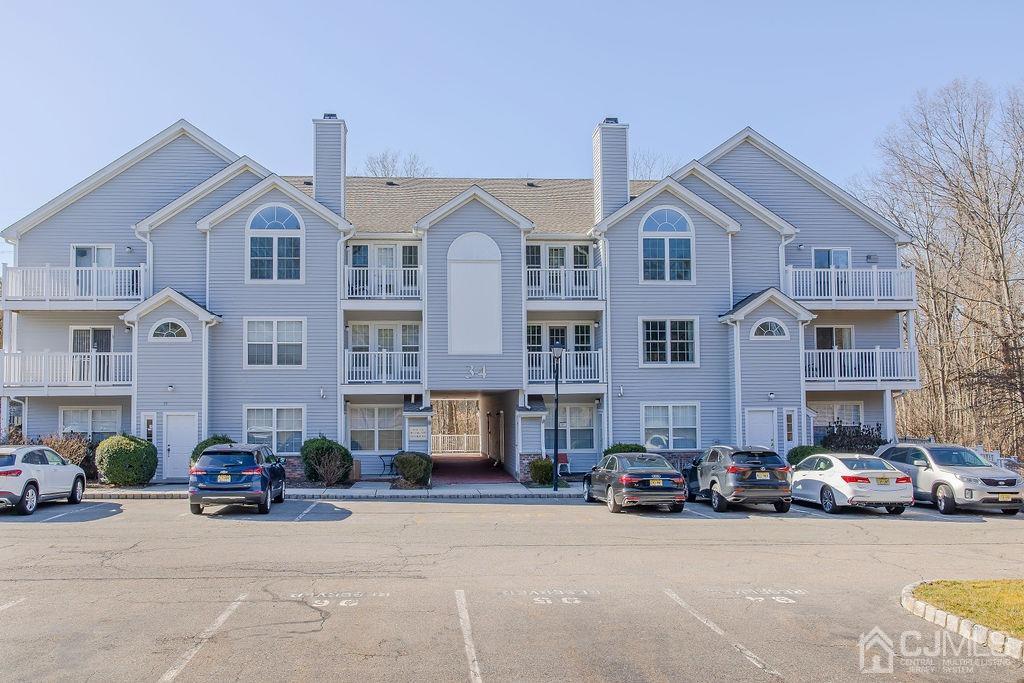 100 Genoble Road Montville, NJ 07045 - Photo 1 of 18 a view of a street that has couple of cars parked in front of it