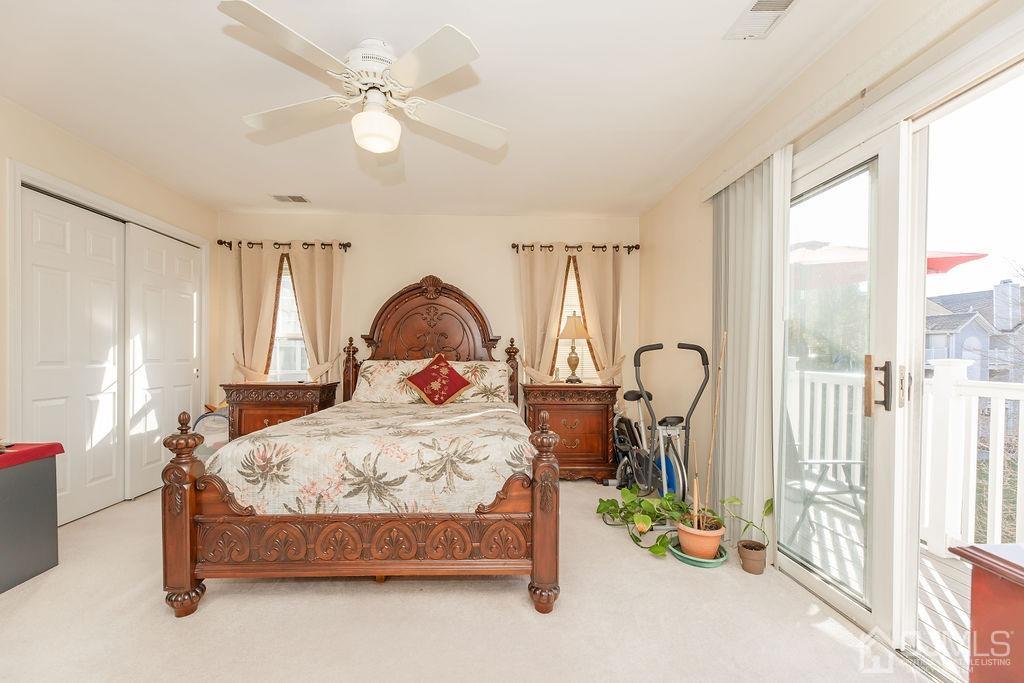 100 Genoble Road Montville, NJ 07045 - Photo 12 of 18 a bedroom with a bed and a large window