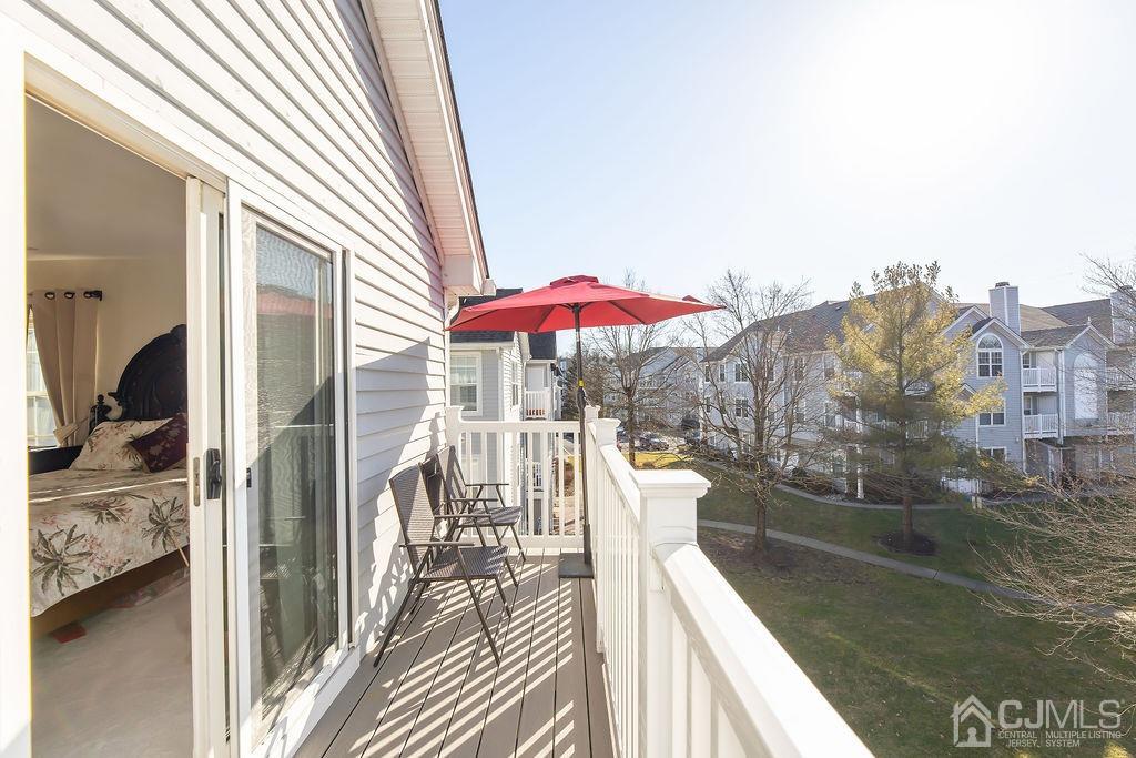 100 Genoble Road Montville, NJ 07045 - Photo 14 of 18 a balcony with furniture and a table