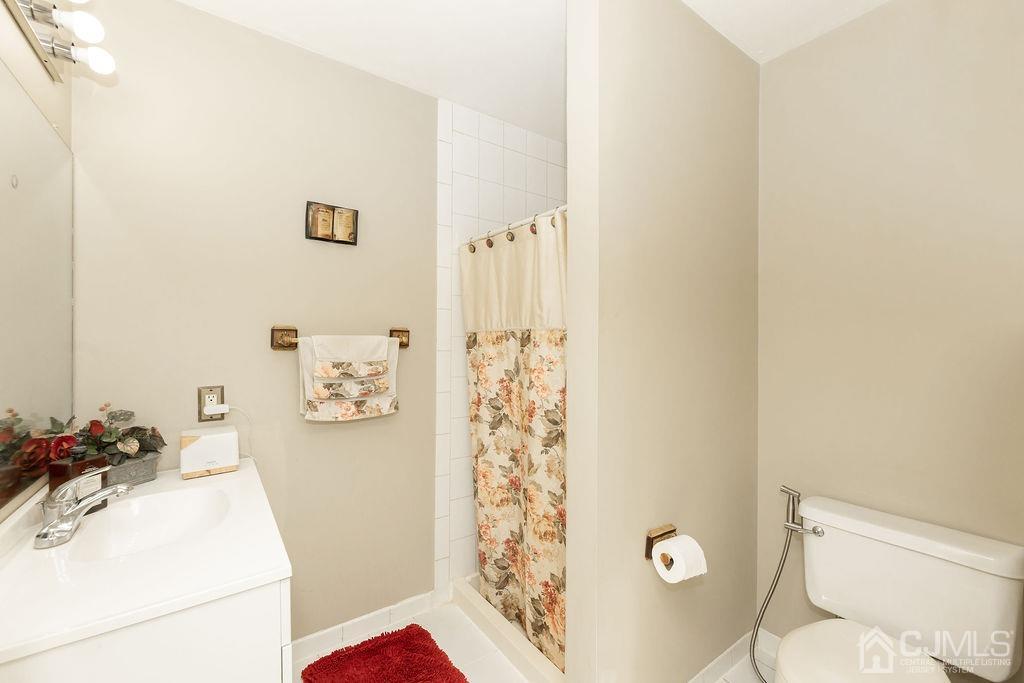 100 Genoble Road Montville, NJ 07045 - Photo 15 of 18 a bathroom with a sink toilet and shower