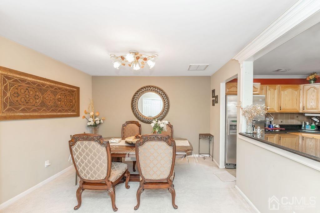 100 Genoble Road Montville, NJ 07045 - Photo 4 of 18 a dining room with furniture a window and wooden floor