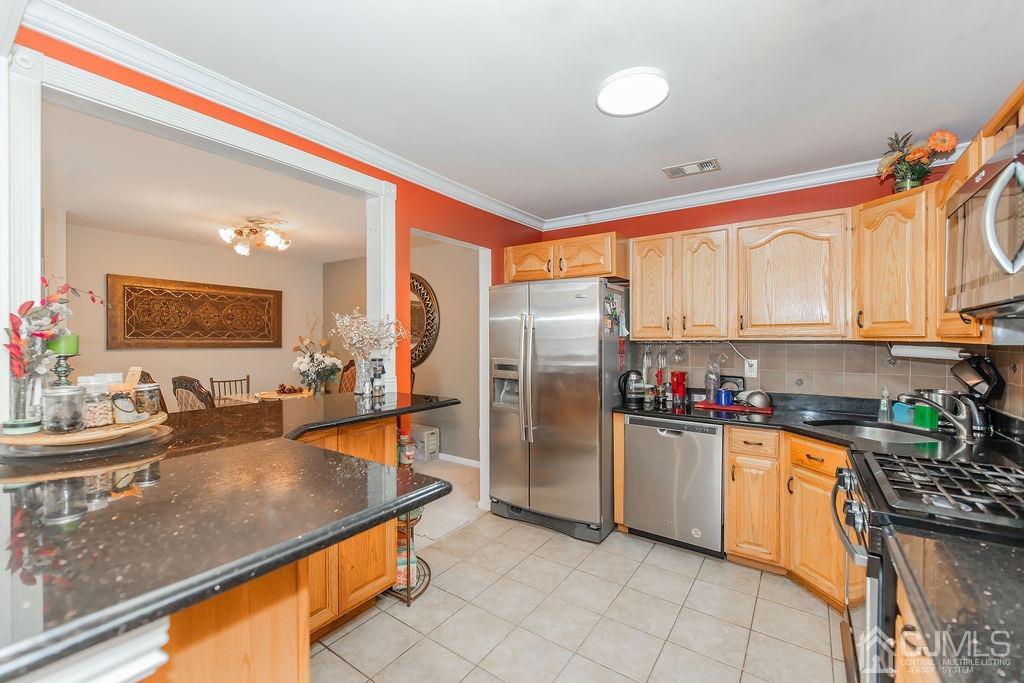 100 Genoble Road Montville, NJ 07045 - Photo 7 of 18 a kitchen with stainless steel appliances granite countertop a sink stove and refrigerator