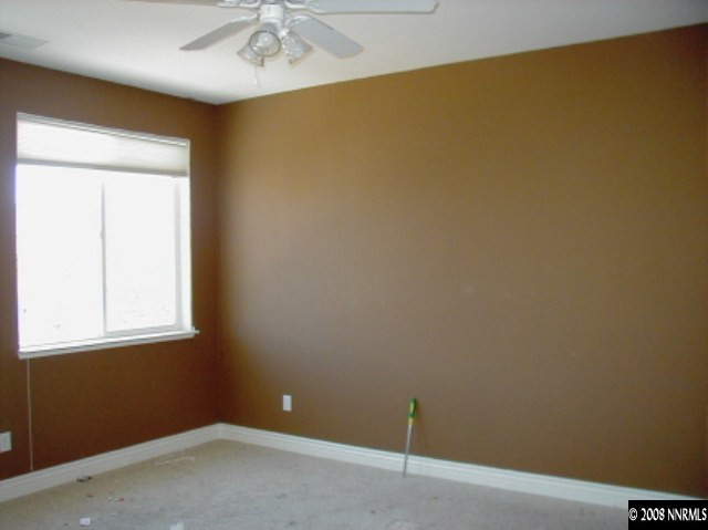 1769 Back Country Road Reno, NV 89521 - Photo 5 of 7 an empty room with a window