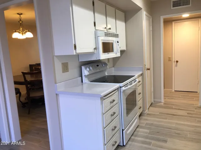 a kitchen with stainless steel appliances granite countertop a stove and a sink