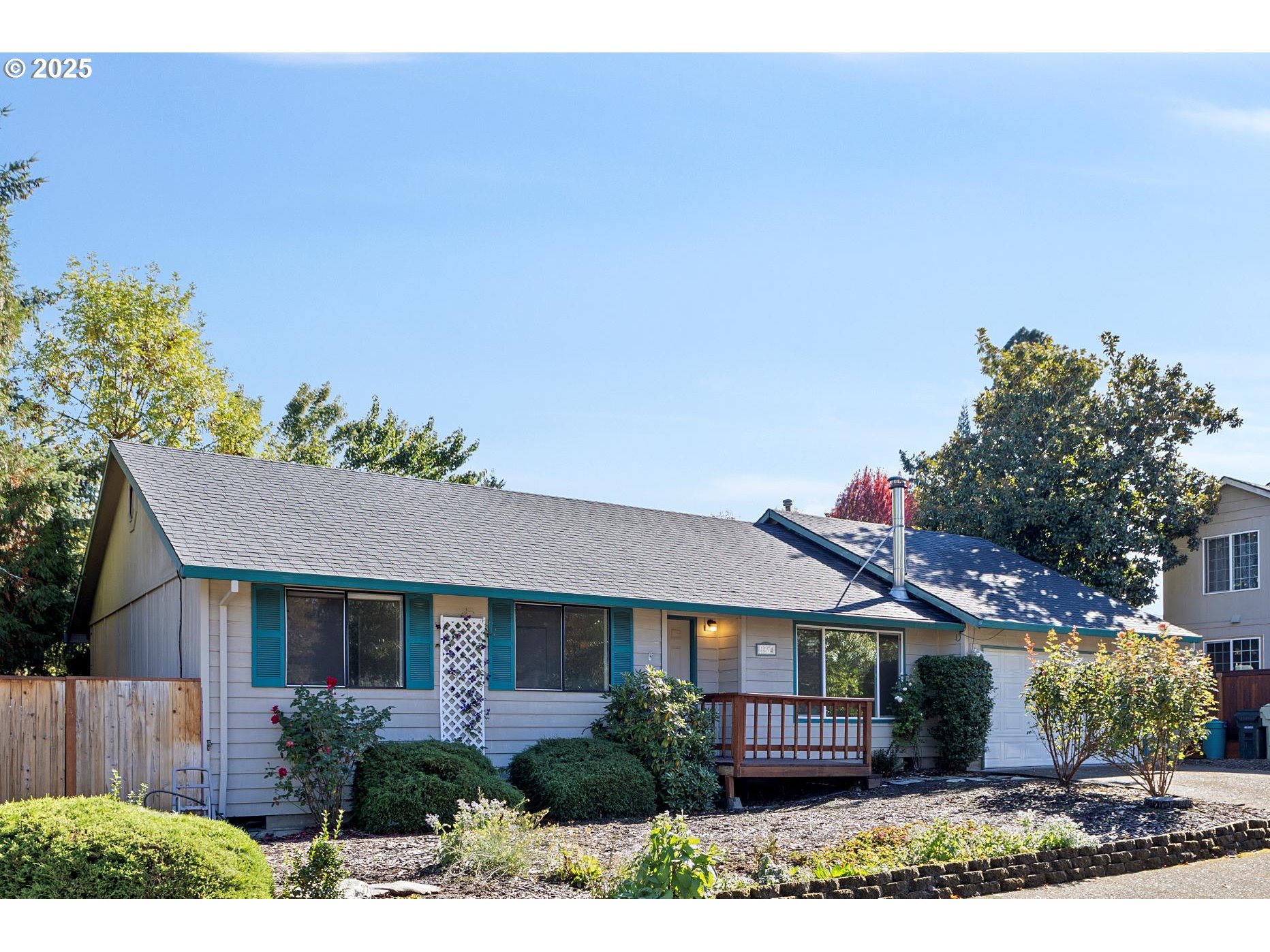 front view of a house with a garden