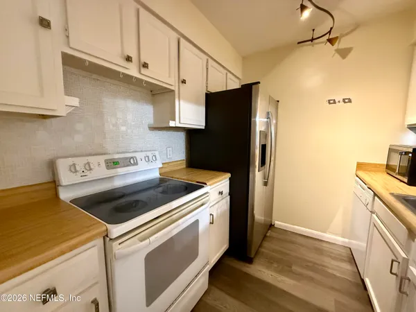 a view of a balcony with wooden floor and outdoor space