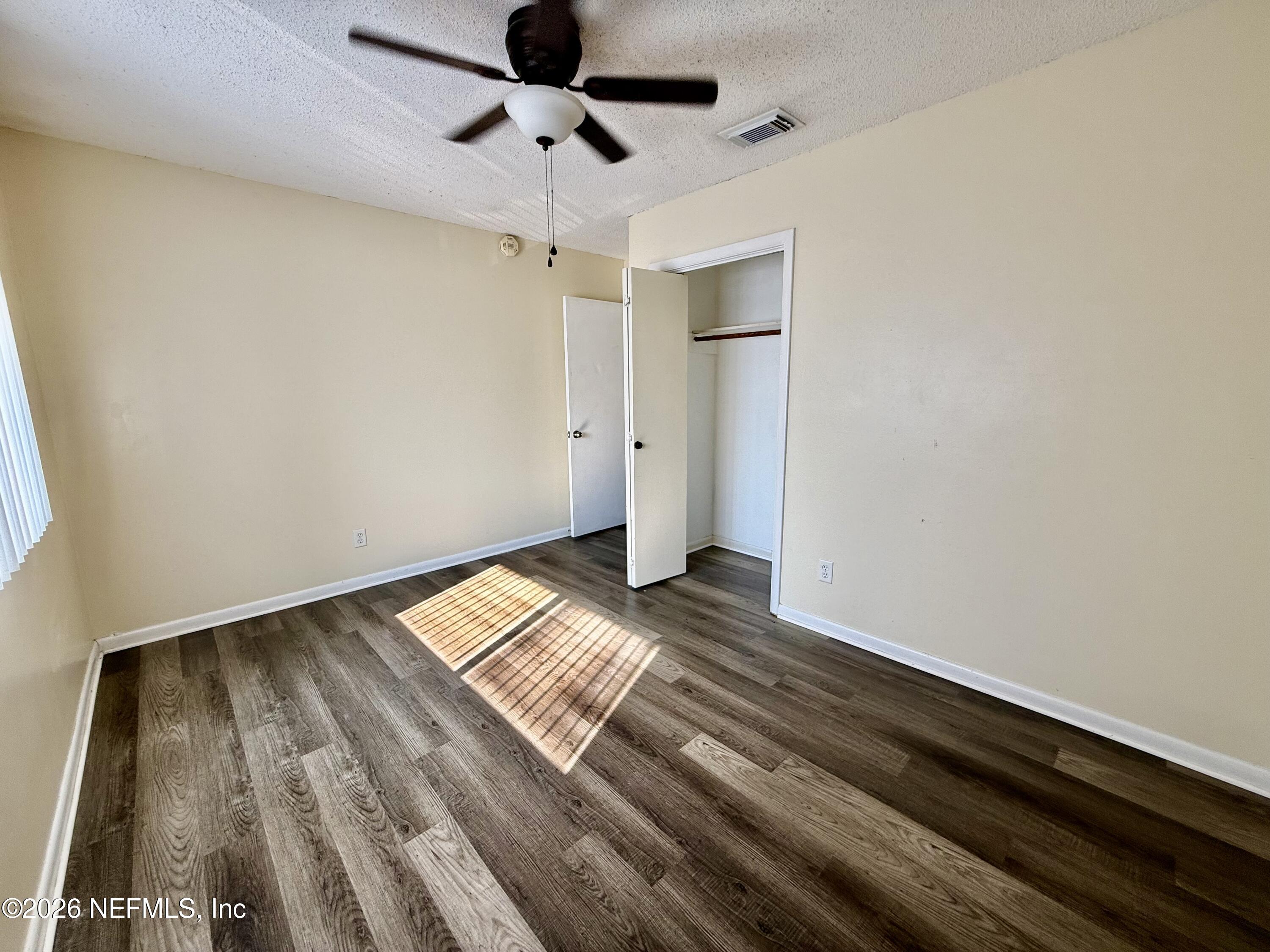 3765 Crown Point Road, Unit 13 Jacksonville, FL 32257 - Photo 27 of 37 a view of empty room with wooden floor