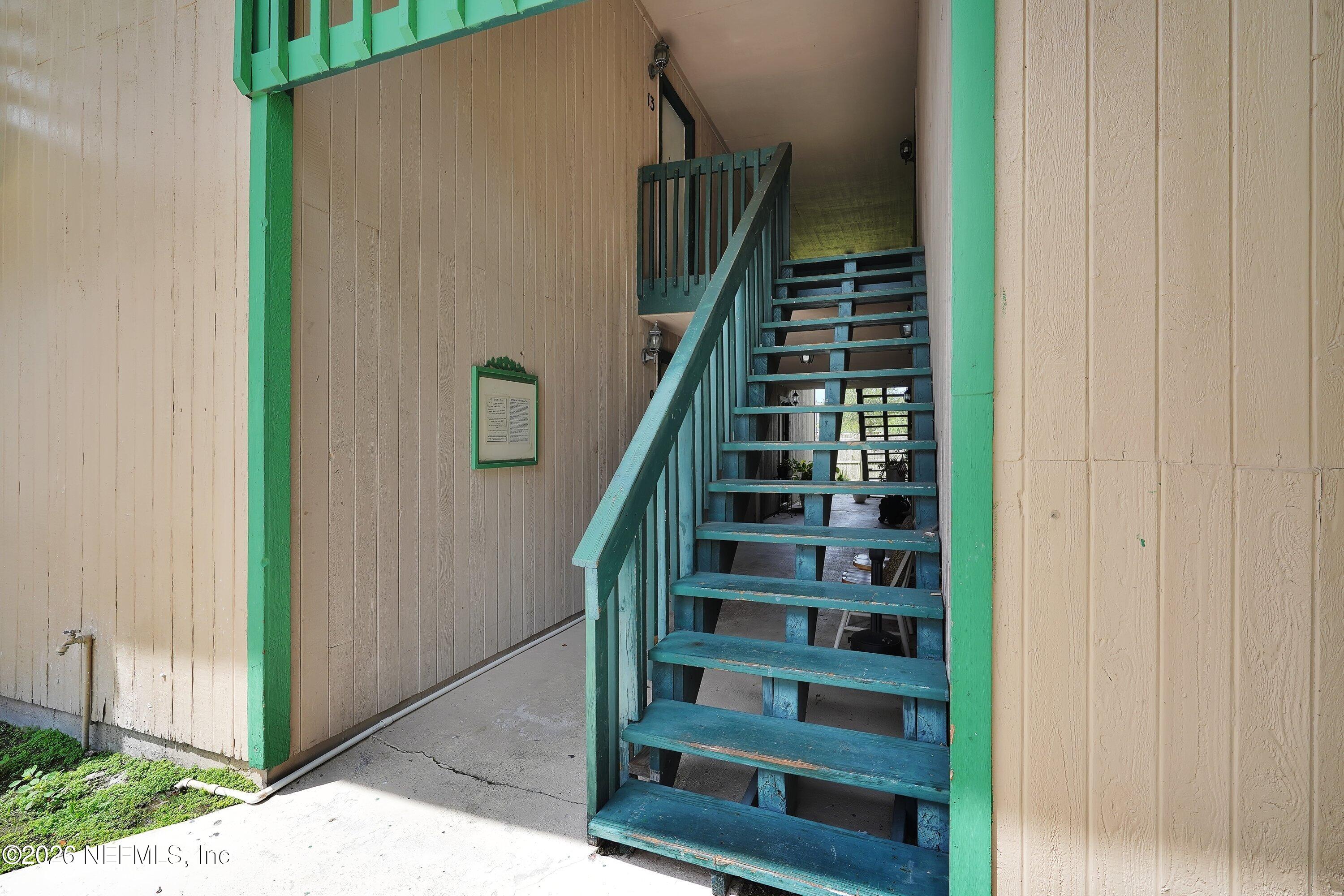 3765 Crown Point Road, Unit 13 Jacksonville, FL 32257 - Photo 6 of 37 a view of staircase with wooden floor and windows
