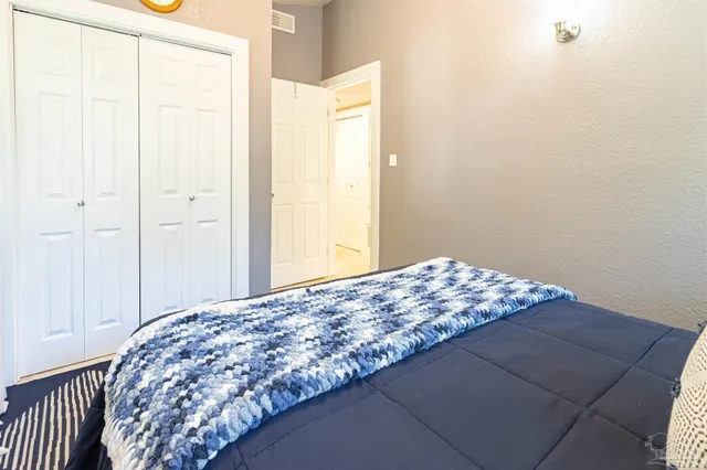 a bedroom with a bed and with curtain