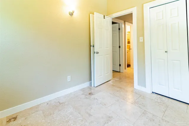 an empty room with a bathroom