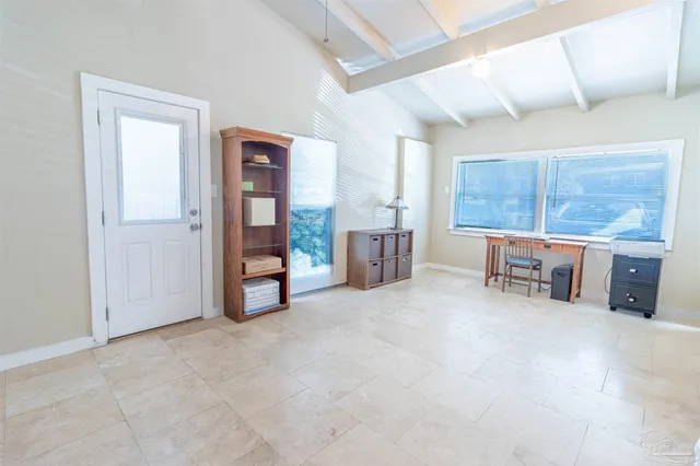 a room with furniture and natural light